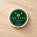 AETOS Wintergreen can on travertine